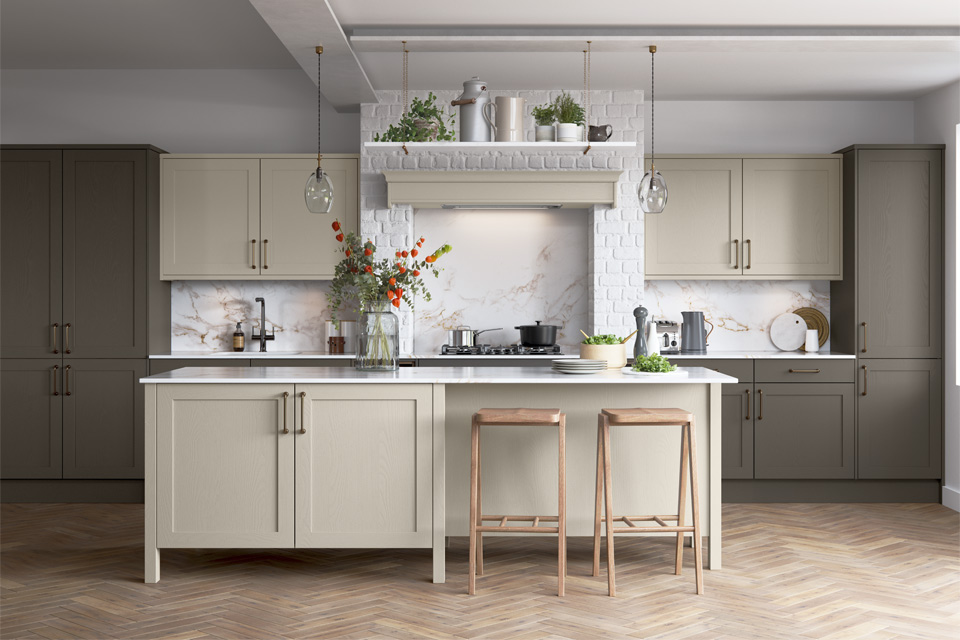 A grey and beige kitchen with beige Shaker kitchen cabinets